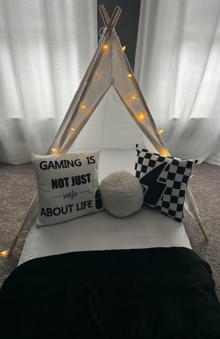 Gaming-themed sleepover tent setup